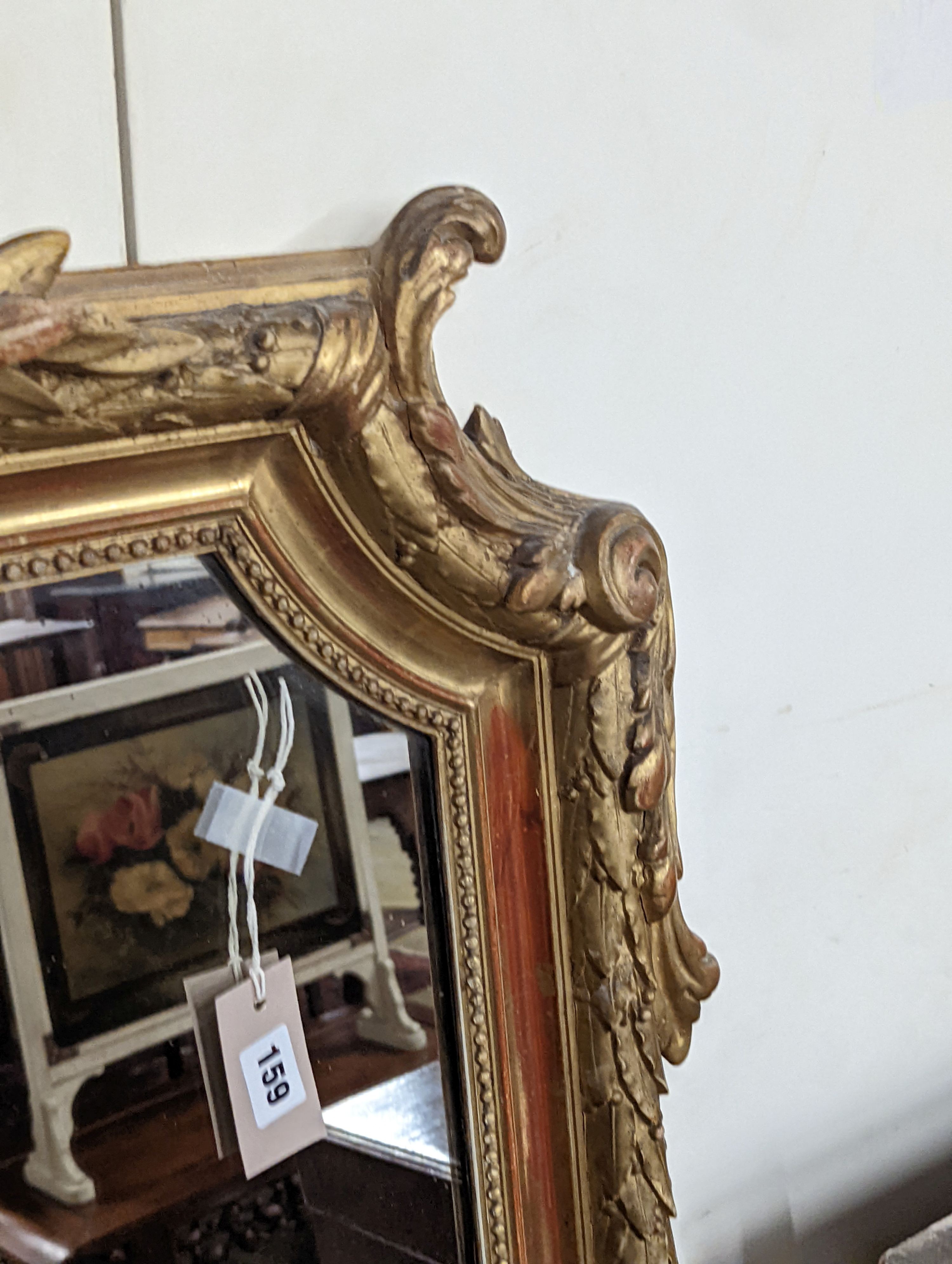 A 19th century French carved giltwood overmantel mirror, width 100cm, height 150cm